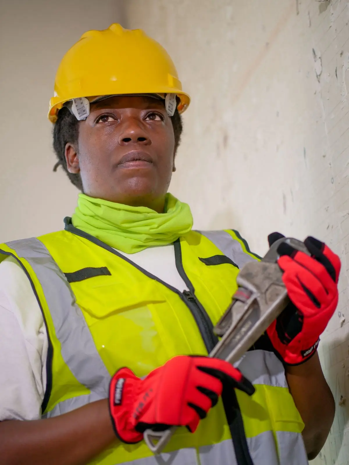 Plumber holding a pipe wrench