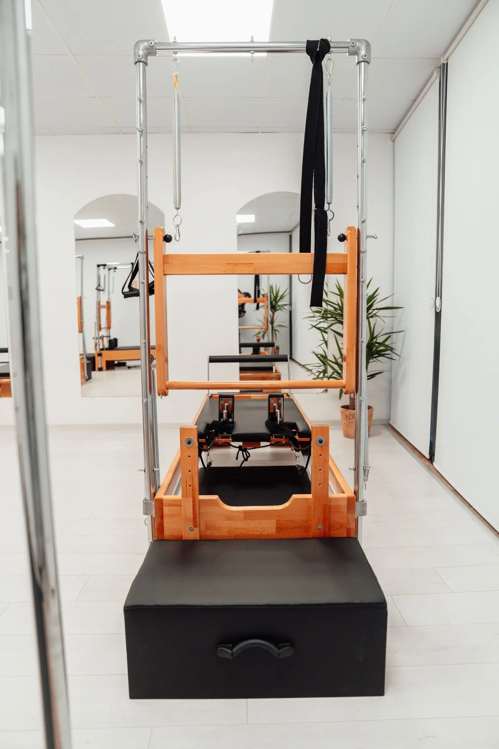 Bright pilates studio with reformers